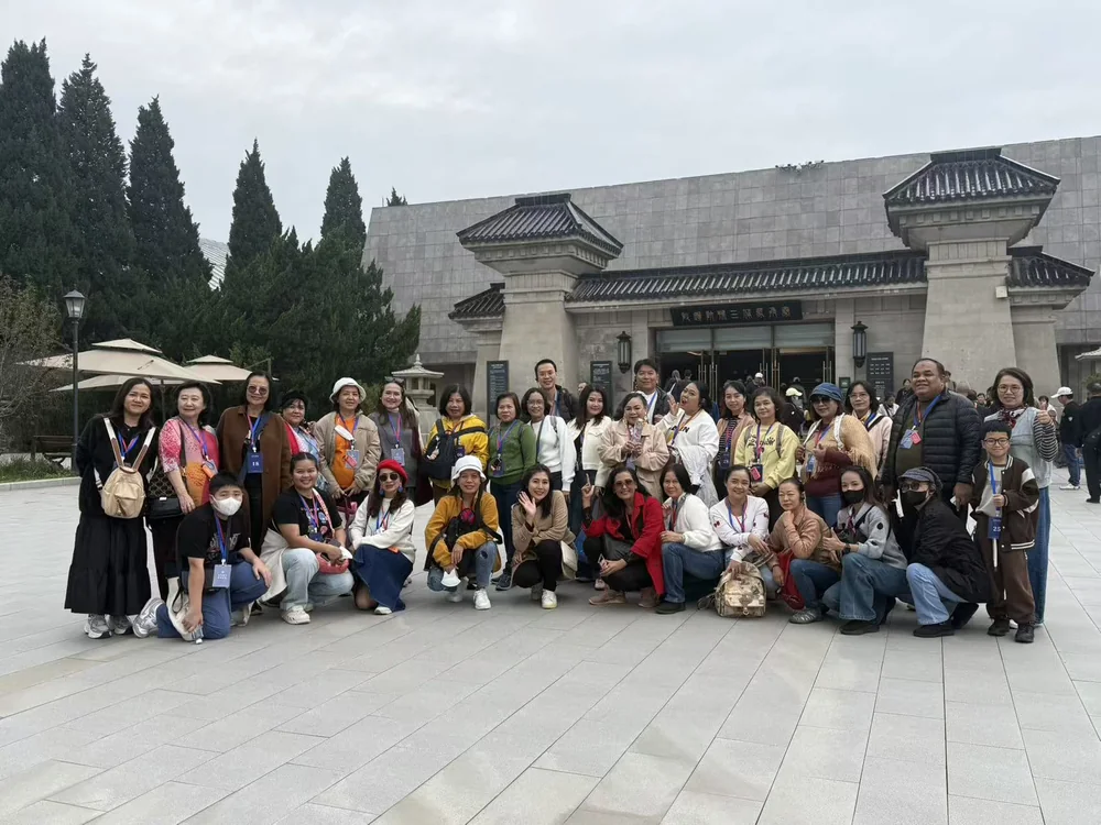 A study group photographed outside a museum entrance