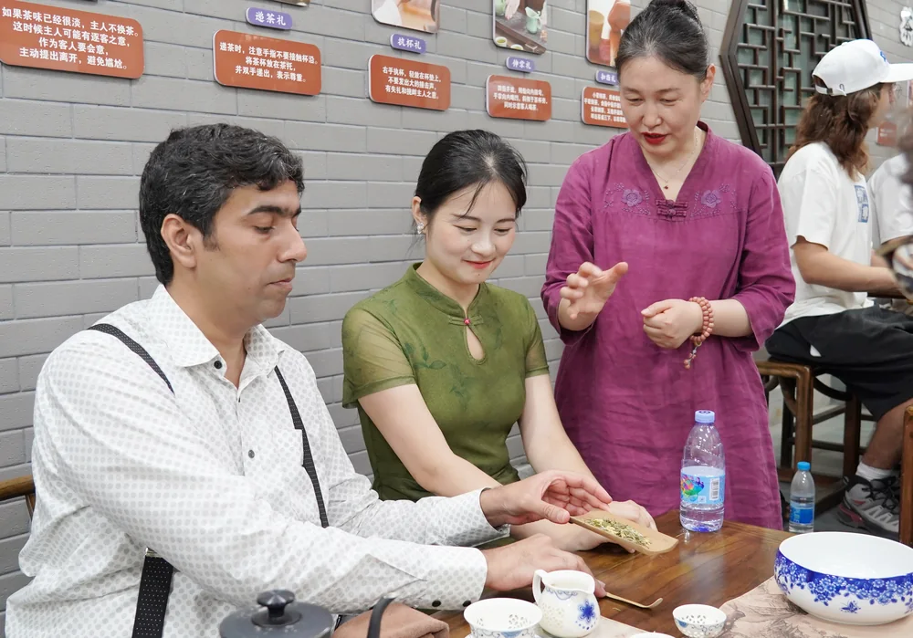 Close-up of hands preparing tea at a tea art session