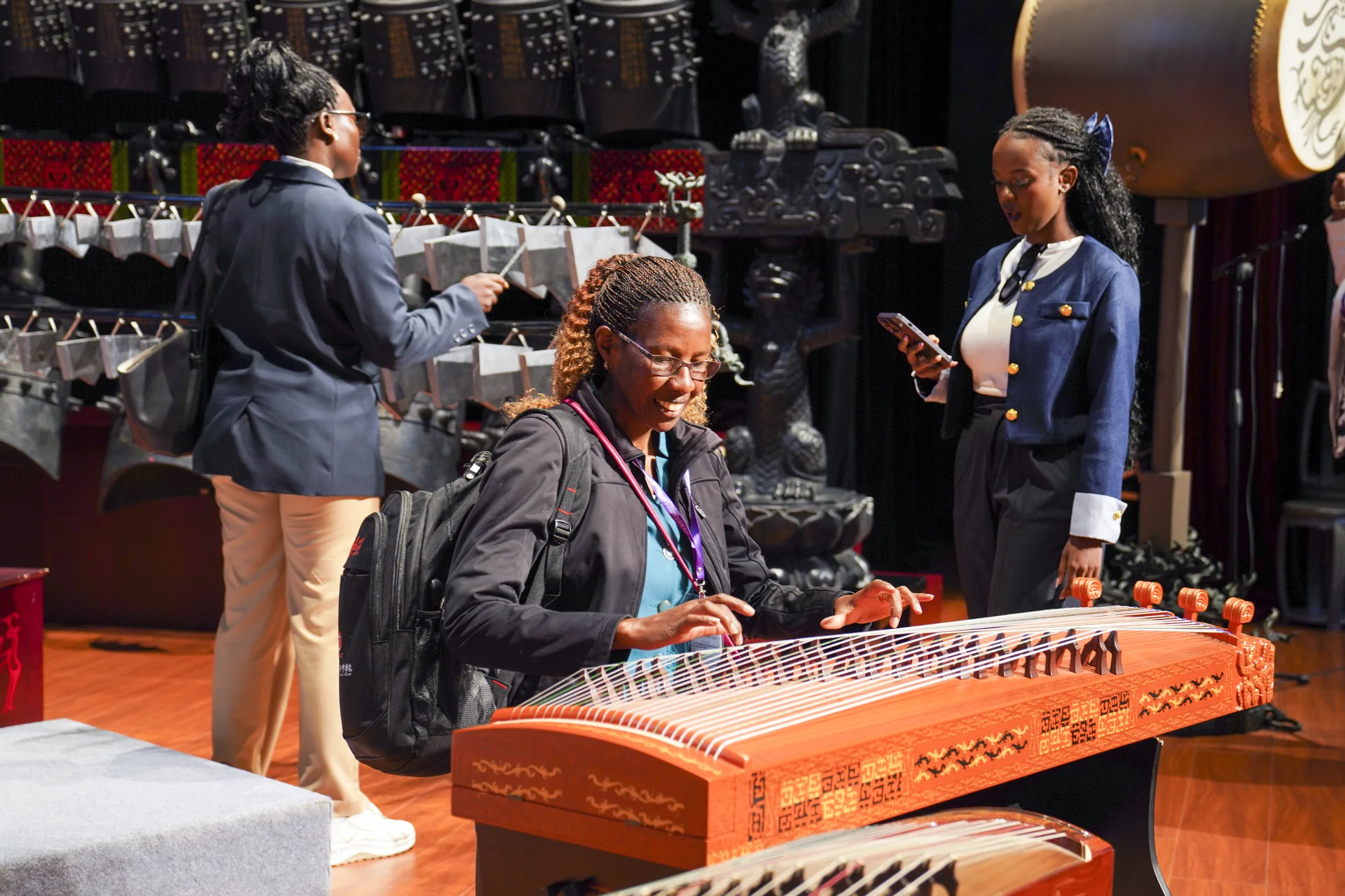 Visitors trying traditional Chinese instruments in a music exhibition hall