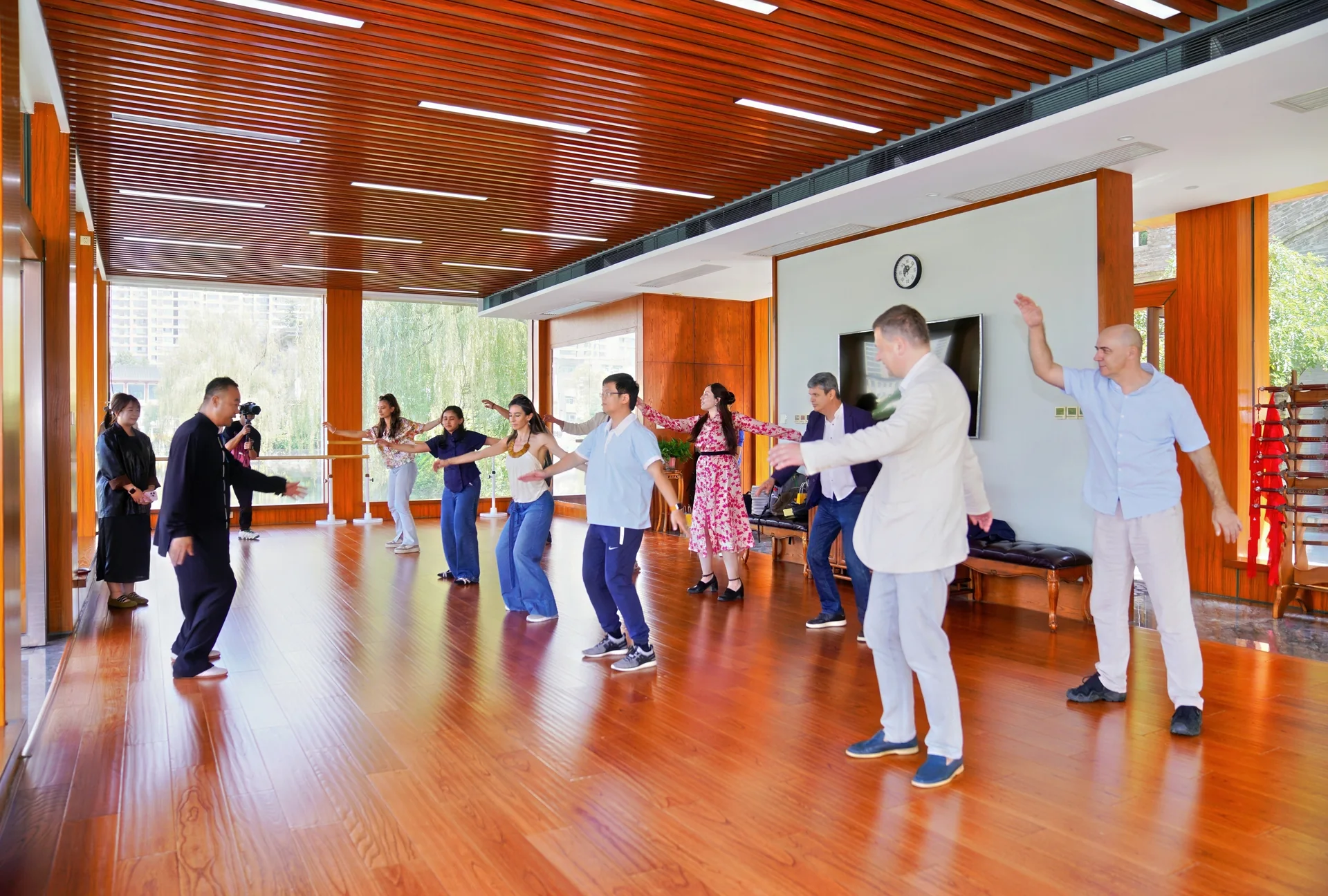 Chinese and international students practising tai chi in a hall